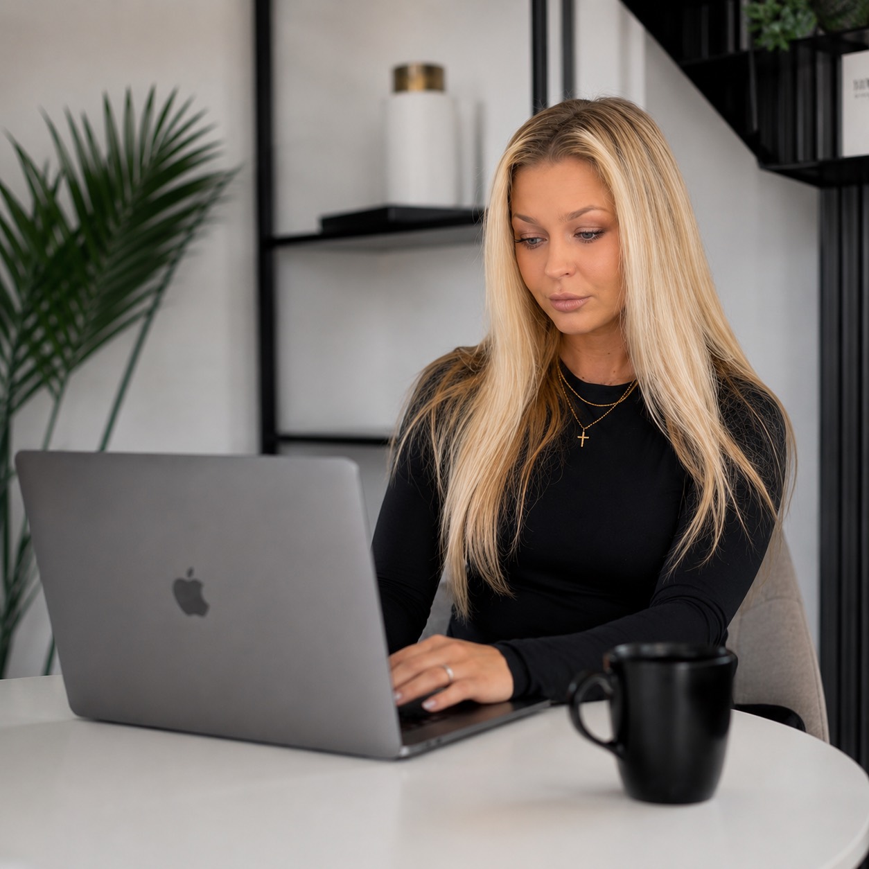 Gintare working on a laptop